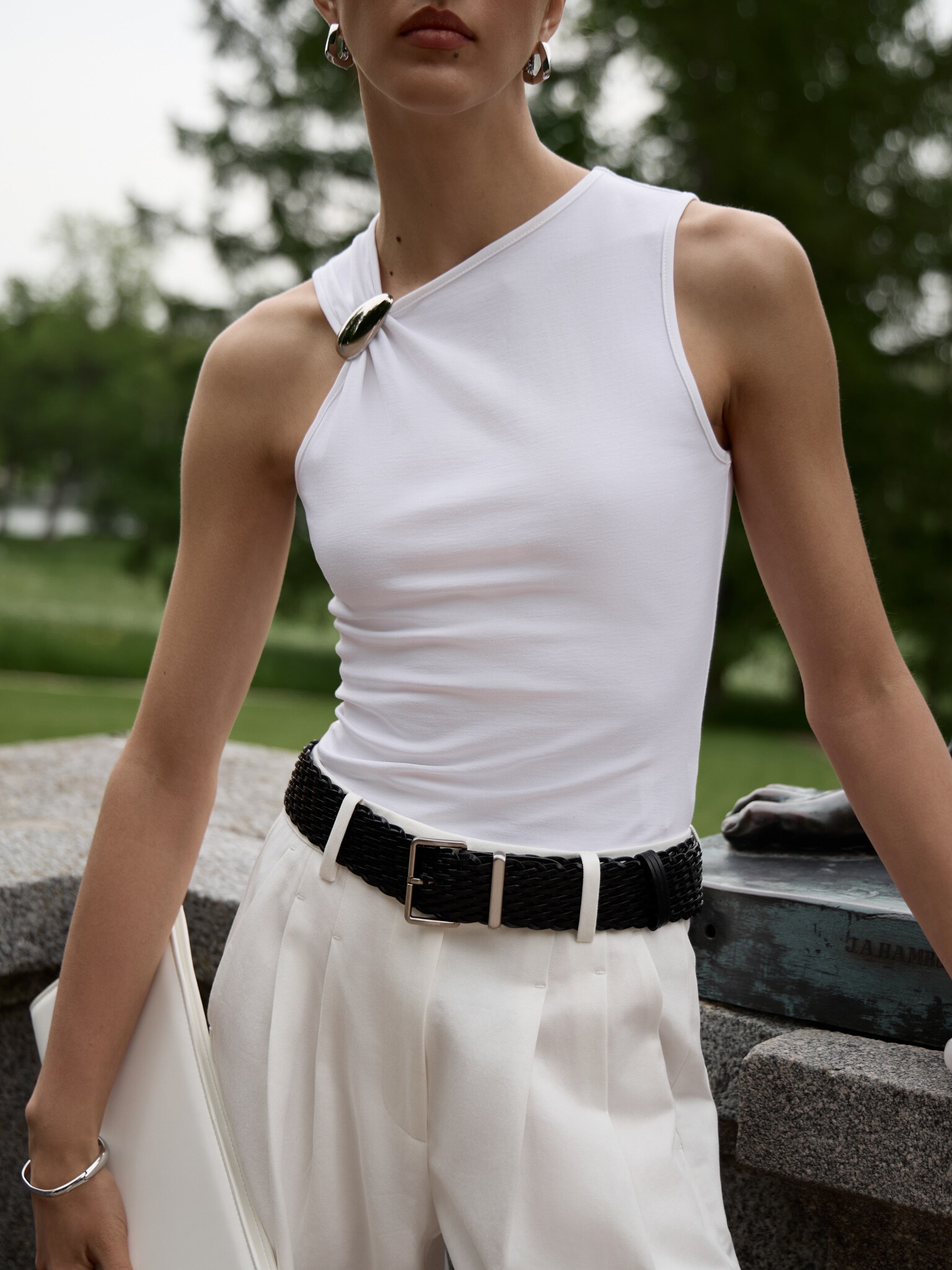 Top with asymmetrical straps and metal decorations