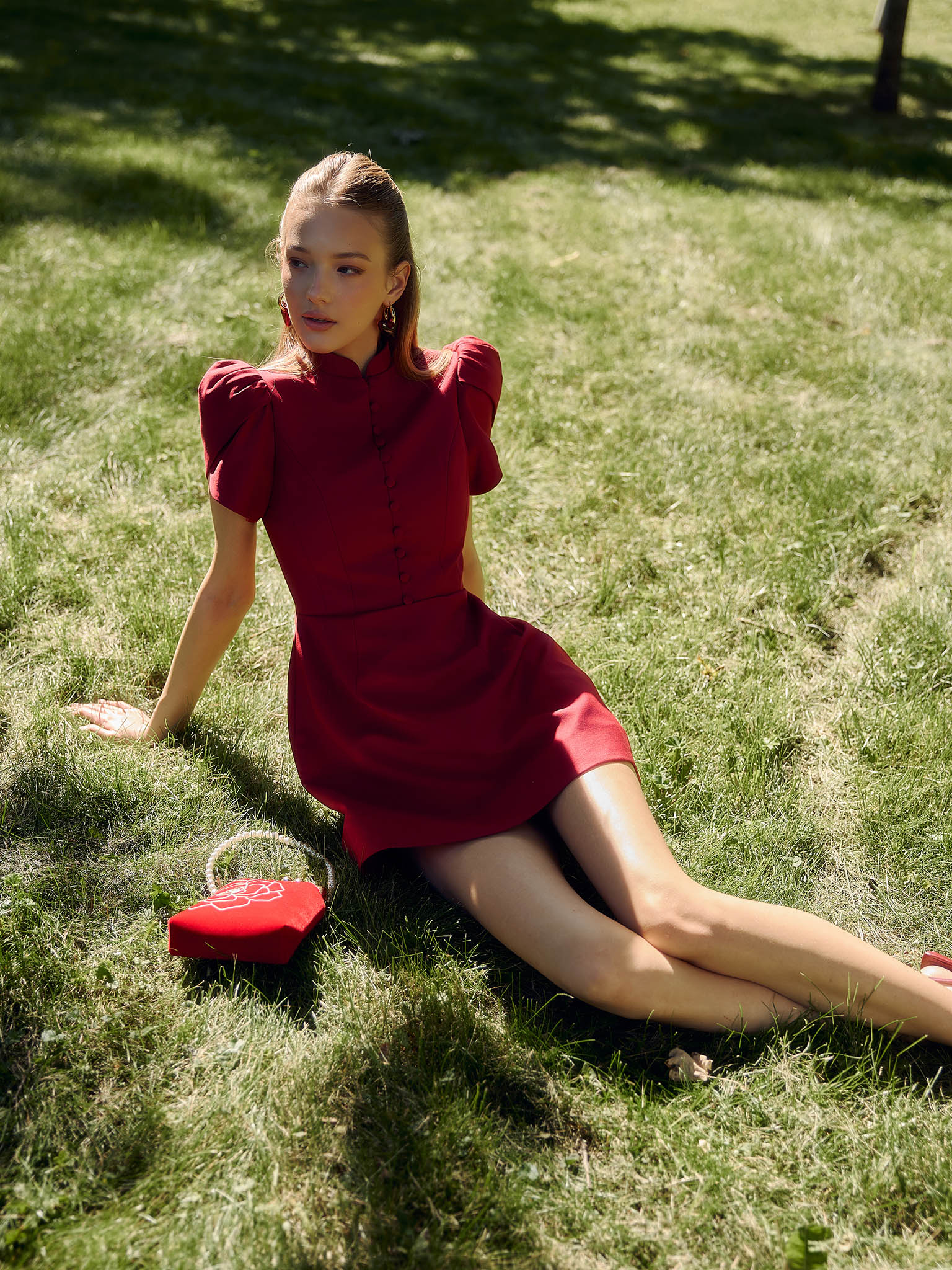 Mini dress with high collar and button fastening