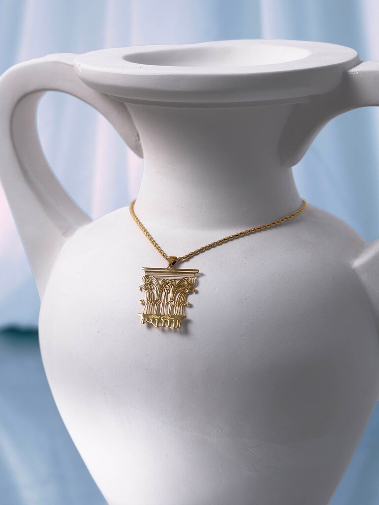 Golden necklace with antique pendant