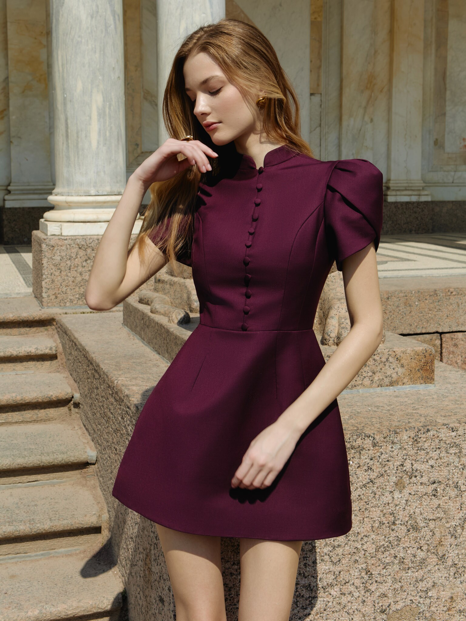 Mini dress with high collar and button fastening