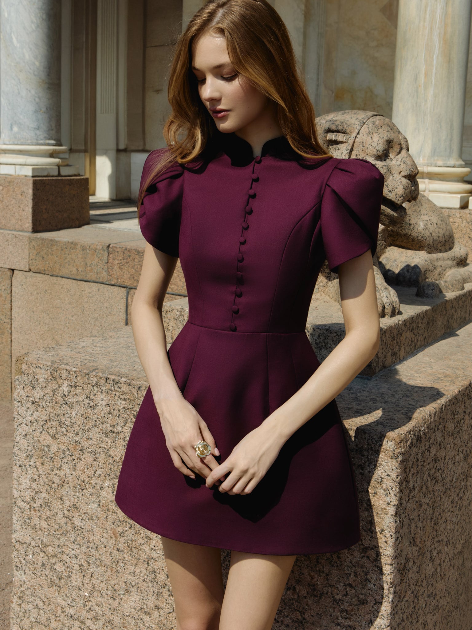 Mini dress with high collar and button fastening