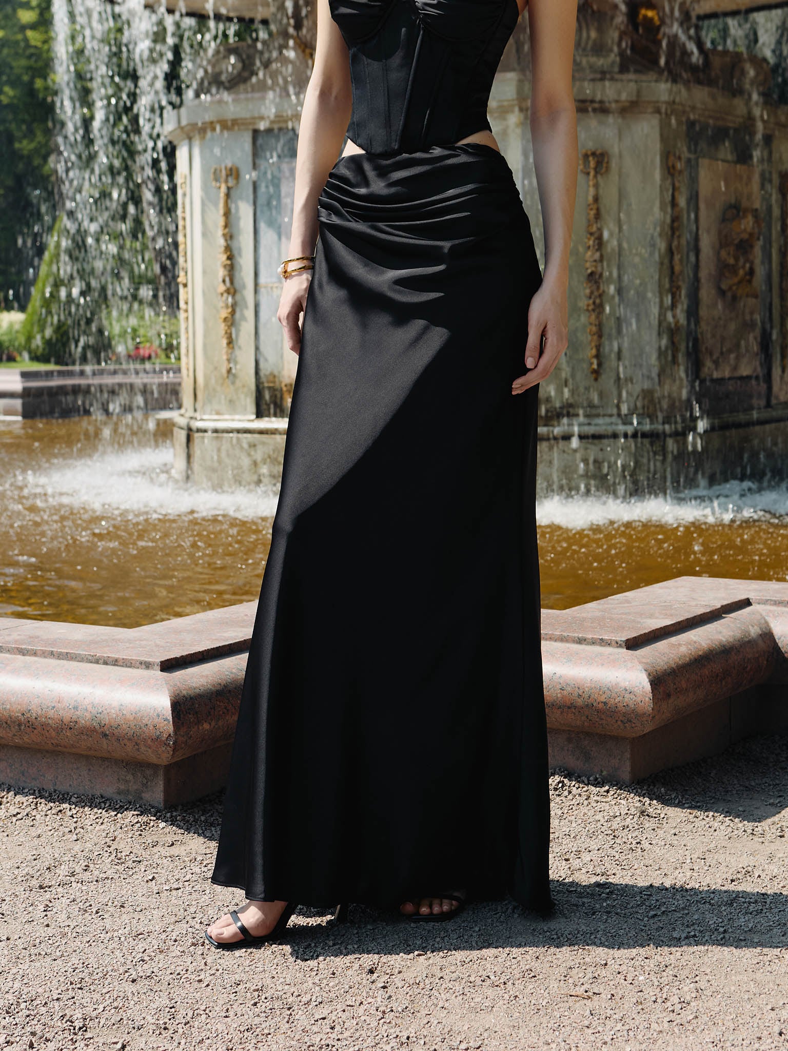 Satin maxi skirt with draping on the hips