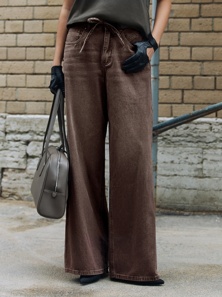 Loose distressed jeans with waist ties