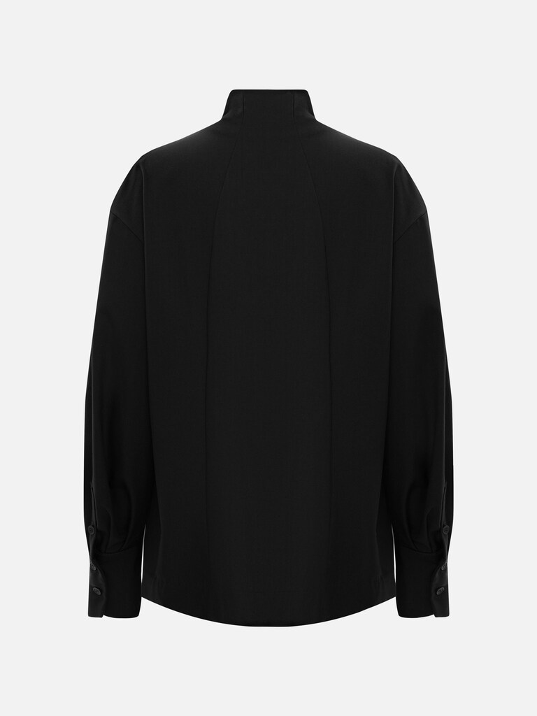 Complex cut shirt with hidden button fastening