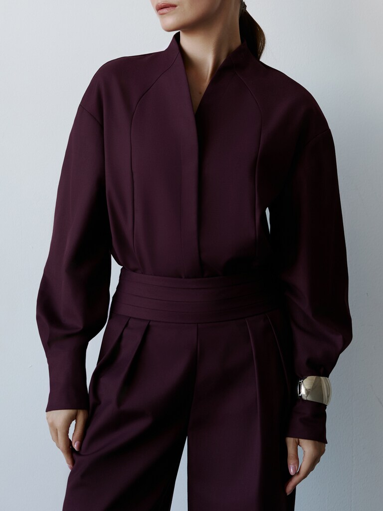 Complex cut shirt with hidden button fastening