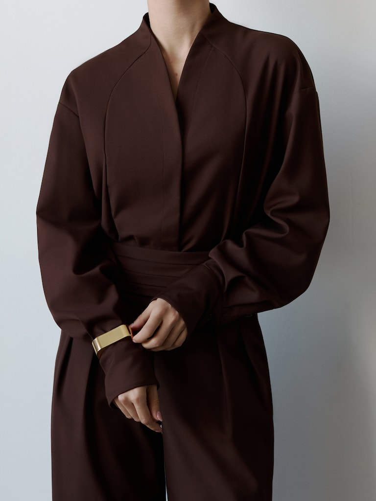 Complex cut shirt with hidden button fastening