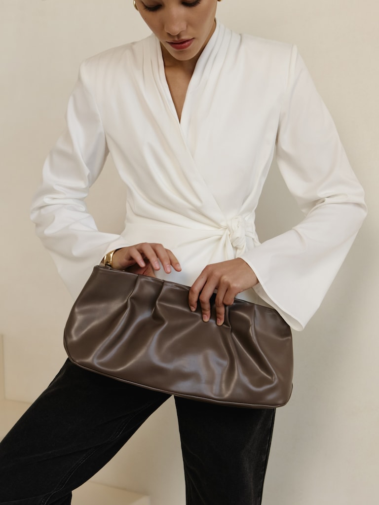 Eco-leather clutch with decorative pleats