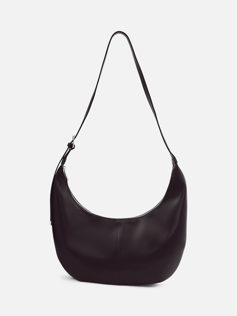 Semi-circular bag with long shoulder strap