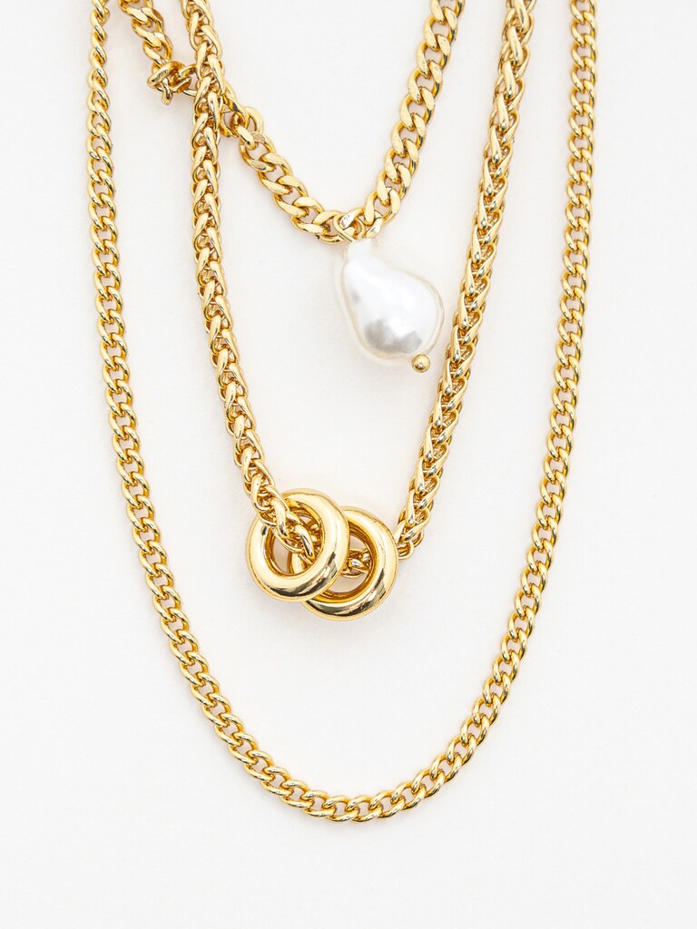 Multi-level golden necklace with large pearls