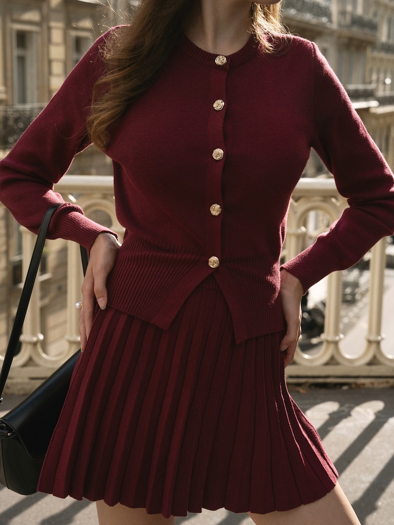 Knitted cardigan with golden buttons