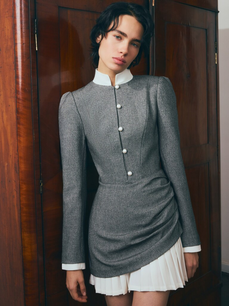 Mini dress with a pleated skirt and pearl buttons