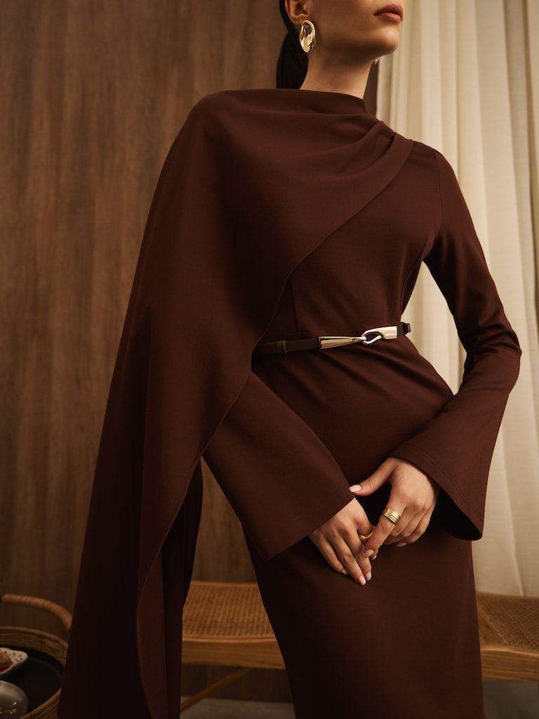 Maxi dress with asymmetrical cape and matching belt
