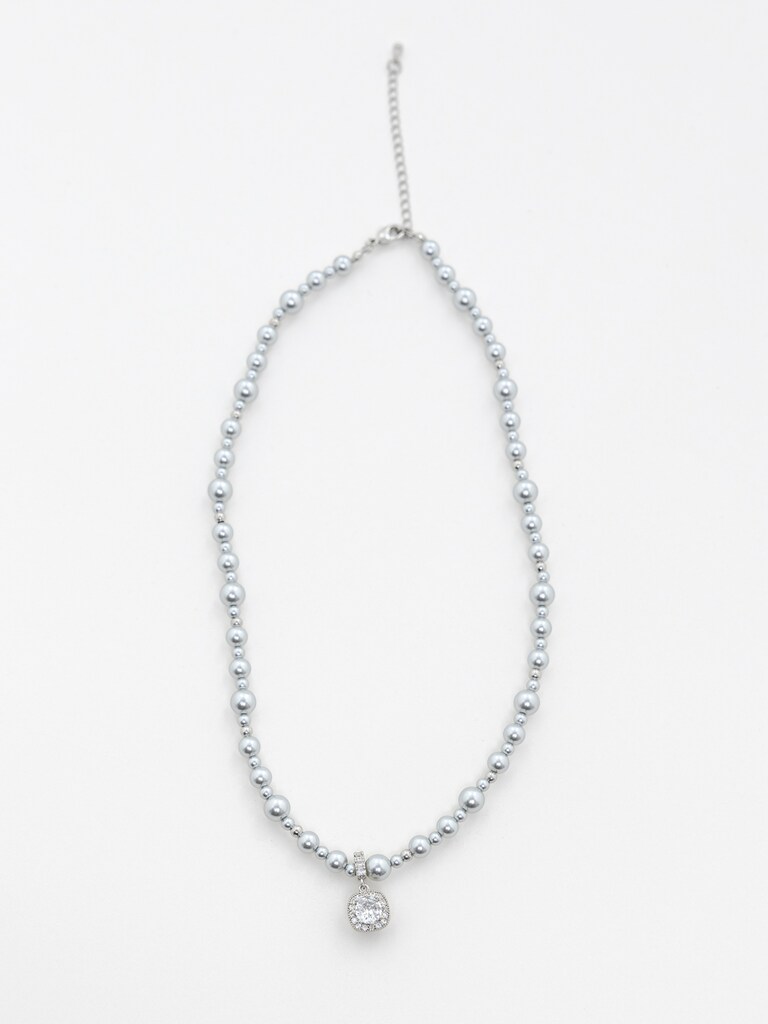 Silvertone bead necklace with a rhinestone pendant