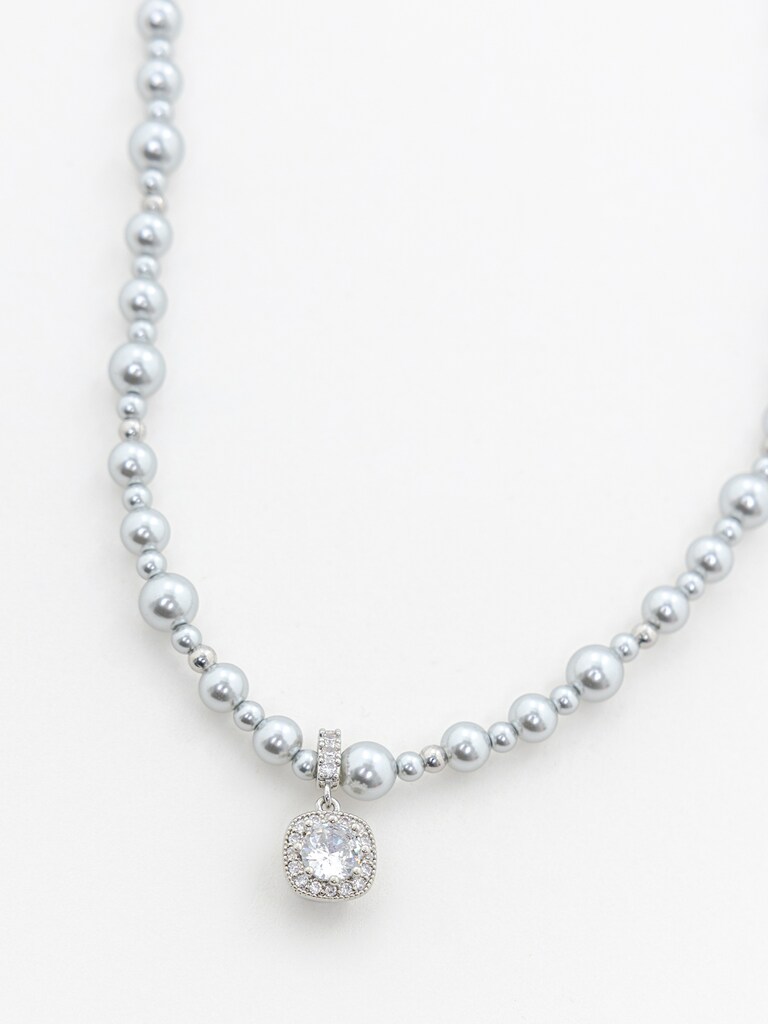 Silvertone bead necklace with a rhinestone pendant