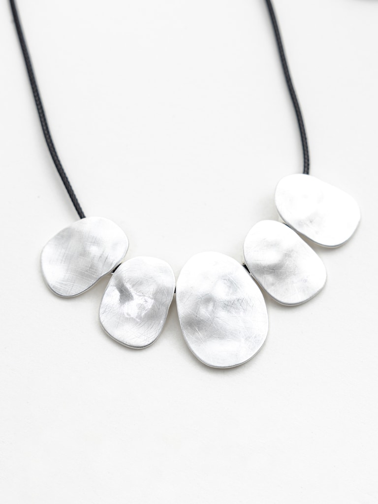 Eco-leather cord necklace with silvertone pendants