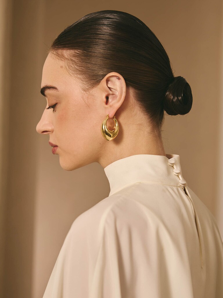 Elongated puffed half-hoop earrings