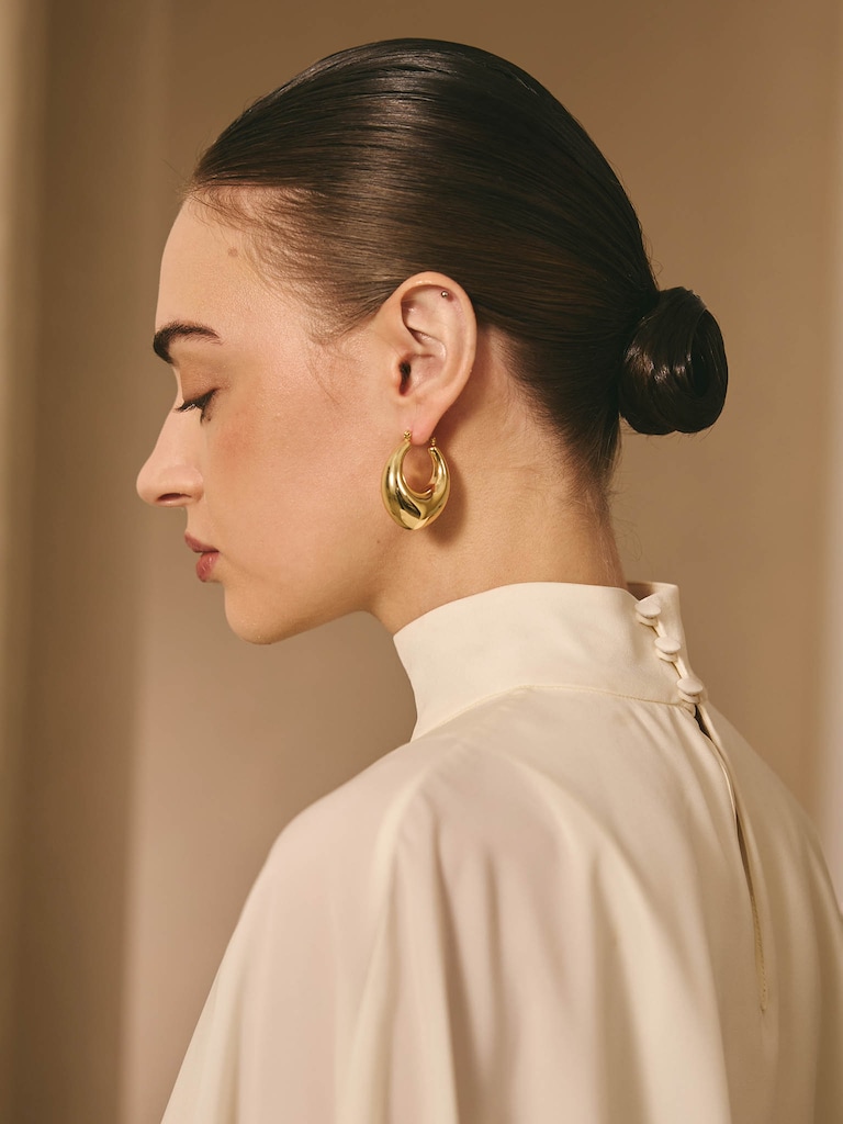 Elongated puffed half-hoop earrings