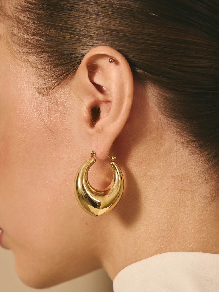 Elongated puffed half-hoop earrings