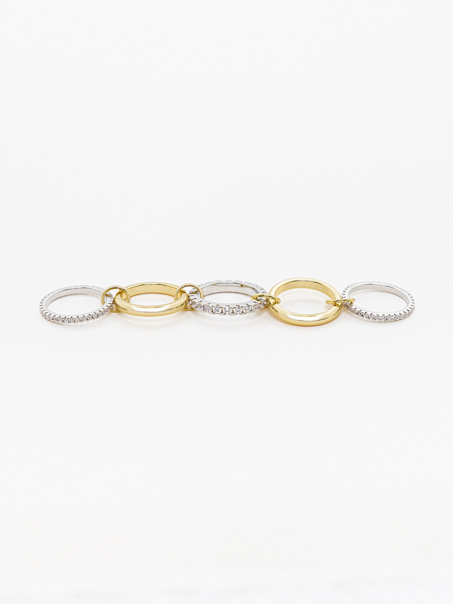 Многослойное кольцо из двух металлов со стразовым декором