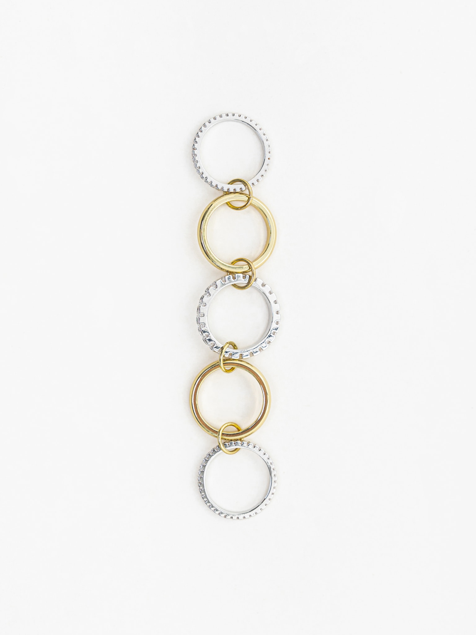 Многослойное кольцо из двух металлов со стразовым декором