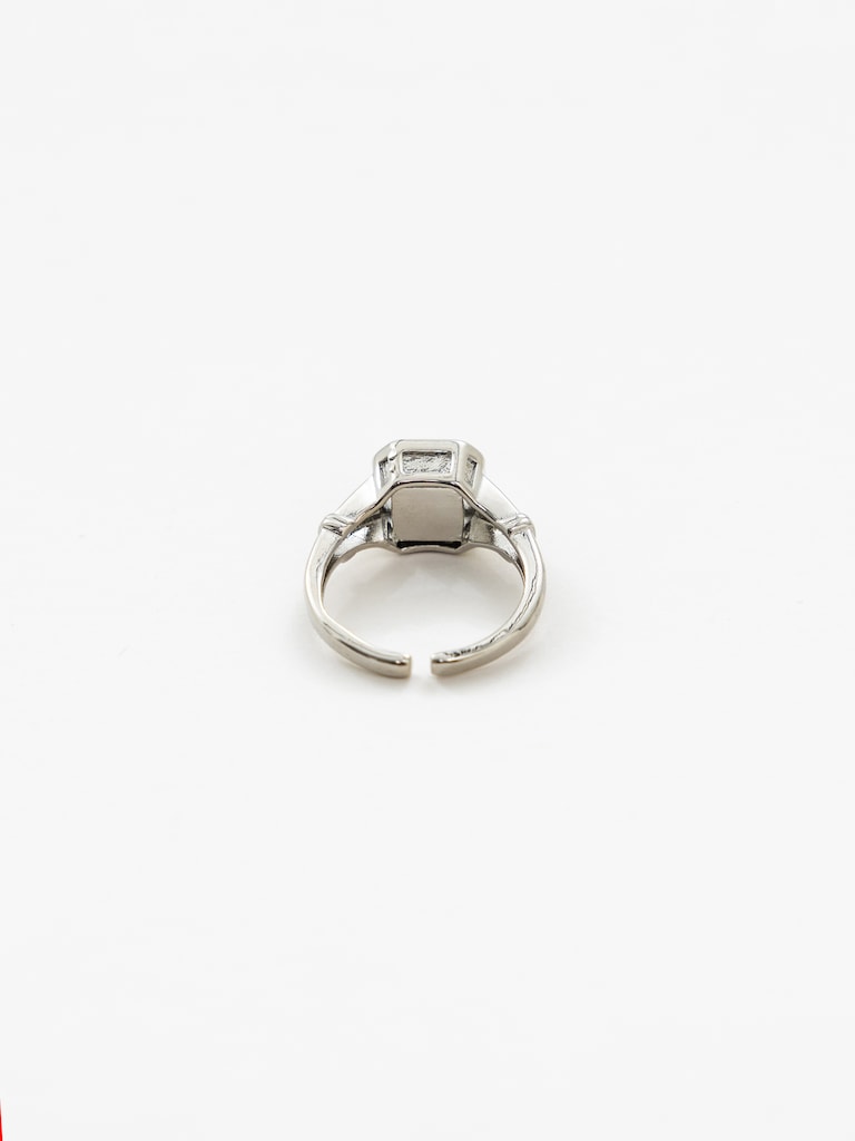 Wide silvertone ring with large crystal