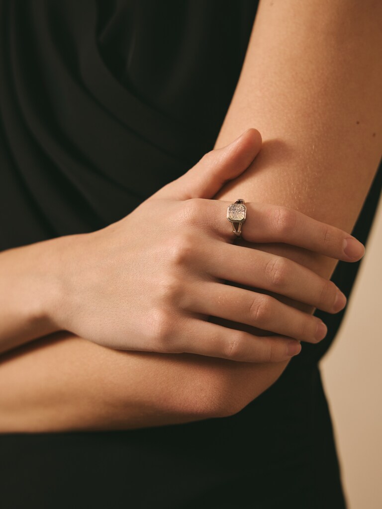 Wide silvertone ring with large crystal