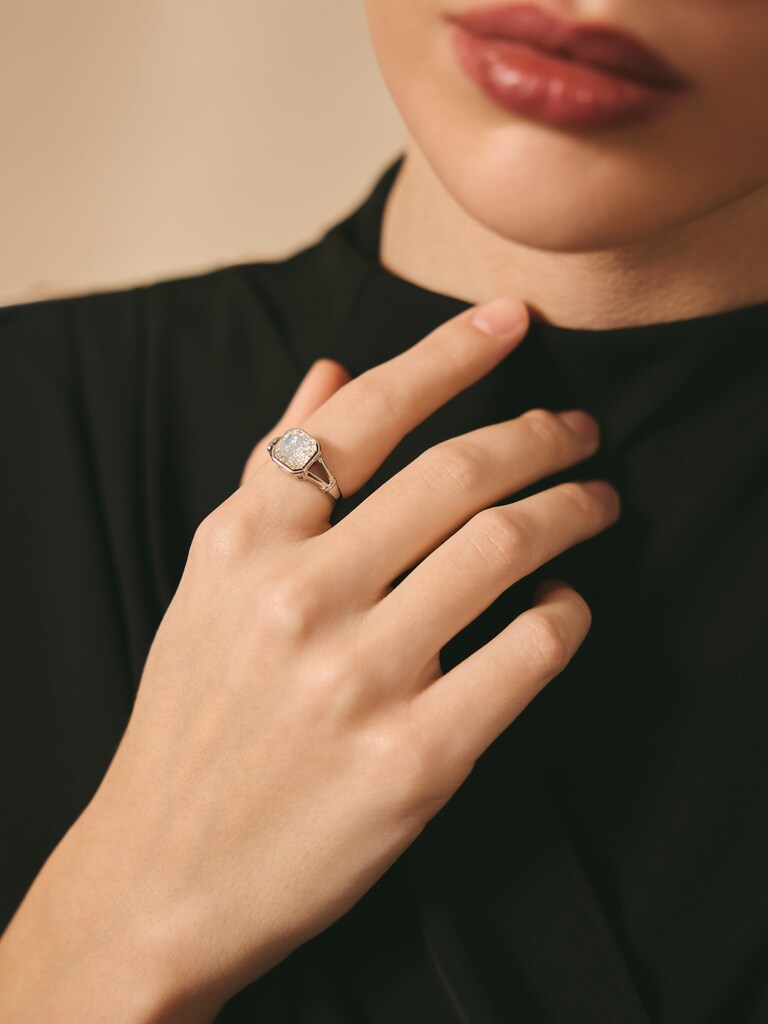 Wide silvertone ring with large crystal