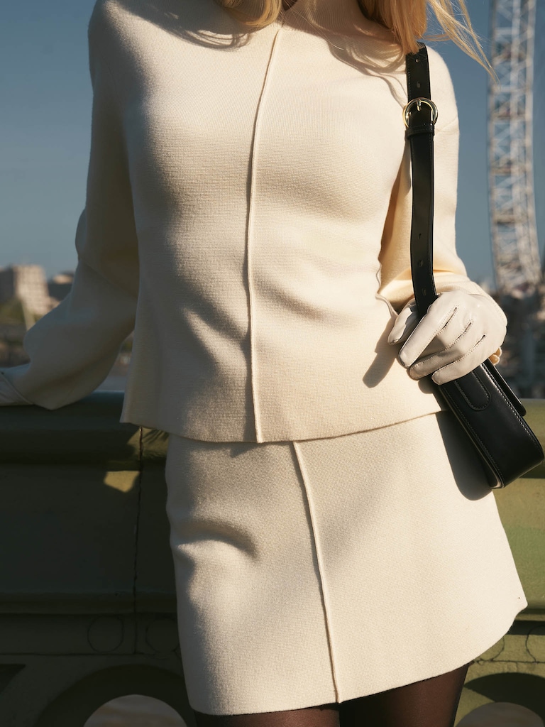 Straight mini skirt with a decorative seam