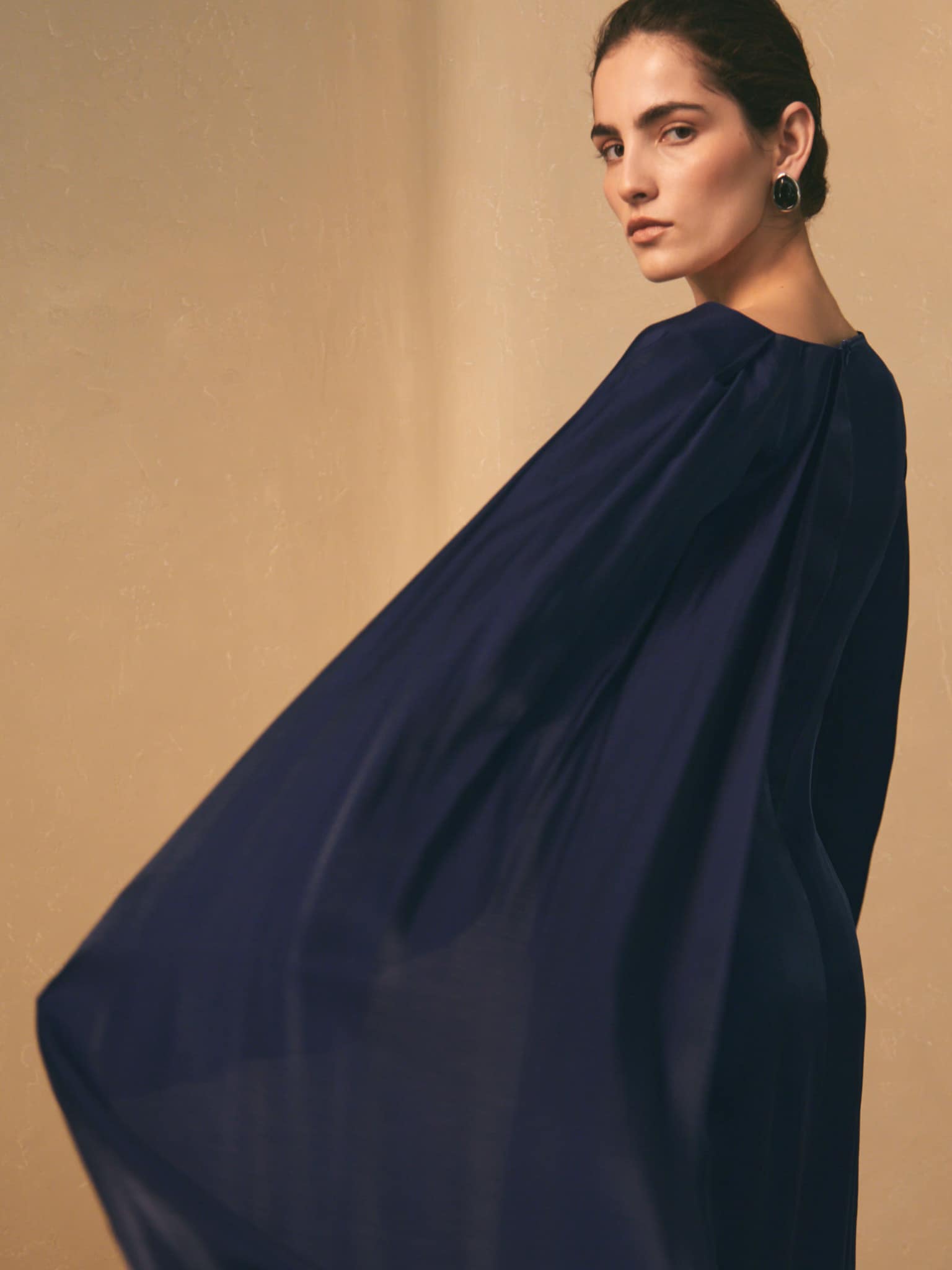 Textured maxi dress with one shoulder cape