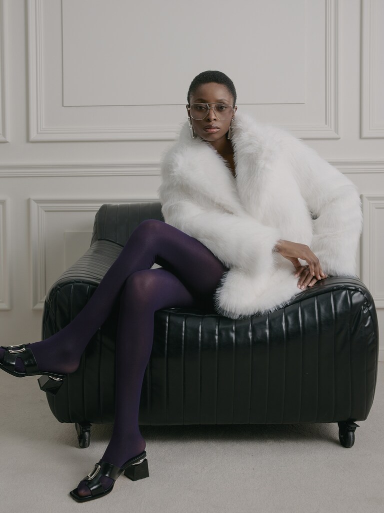 Short loose-fitting eco-fur coat with stand-up collar